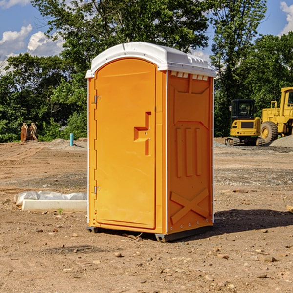 what is the cost difference between standard and deluxe portable restroom rentals in Britton